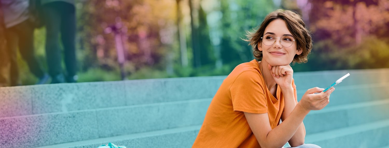 header_woman_mobile-sitting-stone-steps