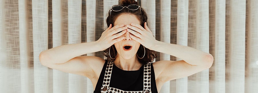 Woman covering her eyes