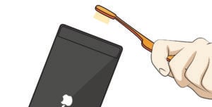 clean phone with toothbrush