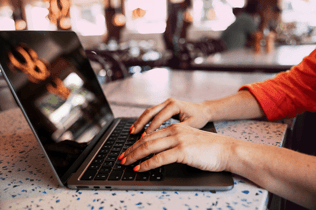 restaurant-woman-caucasian-laptop-hands-orange-nails-dstnyjpg (1)